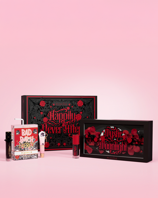 P.Louise halloween makeup collection with 'Happily NEver After' and 'Mystic Moonlight' packaging on a pink background. Featurs an eyeshadow palette, lip stain and lip conditioner and lip oil