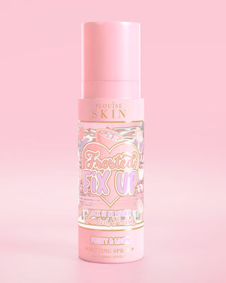 Pink bottle of P. Louise Skin Breakfast Frosted Fix Up Blurring Setting Spray in Fruity & Loopy scent infused with skincare on a pink background