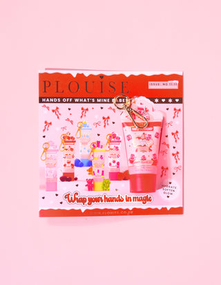 P.Louise christmas magazine featuring a mini keychain saucy cranberry hand cream attached to the magazine with a red and pink festive design