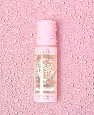 An image of the P.Louise Forever Set setting spray covered in water droplets on a pink background covered in water droplets