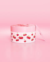 Conteneur rose avec motif cerise sur fond rose