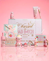 P.Louise Strawberry Obsessed For Bad Bitch products surrounding the packaging on a pink background