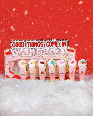 P.Louise 'Good Things Come In Small Packages' mini lip conditioner gift set best sellers on a red background surrounded by snow
