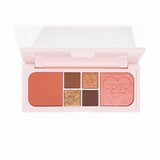 Une image de la mini palette yeux et visage Fluffy Fantasy de P.Louise, composée de mats crémeux et de reflets beurrés dans une gamme de nuances pêche, marron et neutres.
