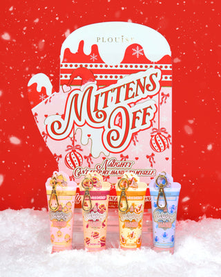 Set of P.Louise 'Mittens Off' naughty hand cream gift set in a festive mitten package against a red background and surrounded by snow