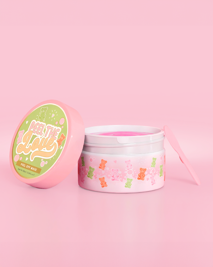 Récipient rose avec motif ours en bonbons sur fond rose